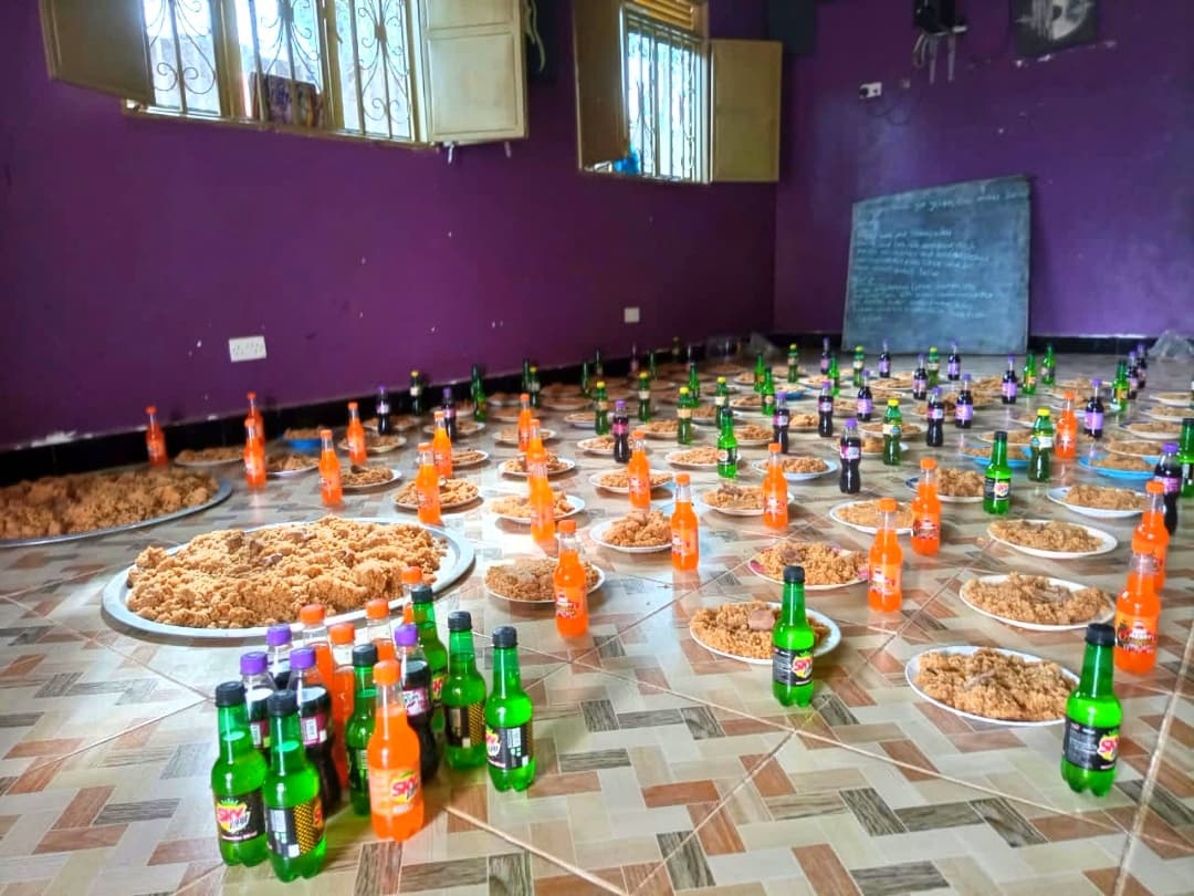 Plates of rice and soda arranged on the floor for Christmas celebration