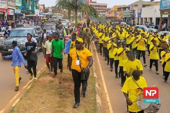 Elgon Youth Brass Band leading a city-wide street march through Mbale