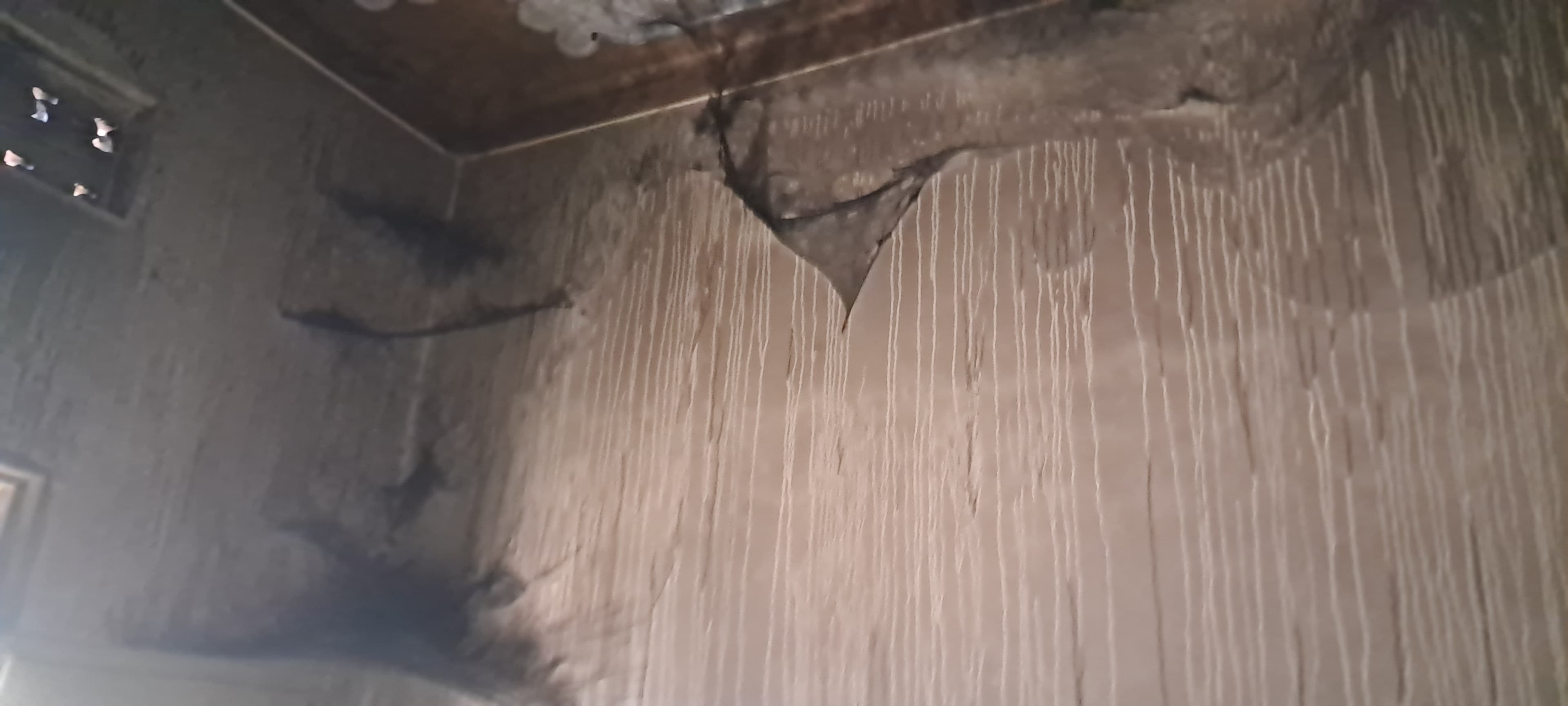 Charred walls and ceiling after the fire