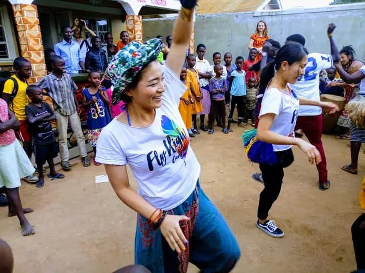 Volunteers dancing with the children at the foundation